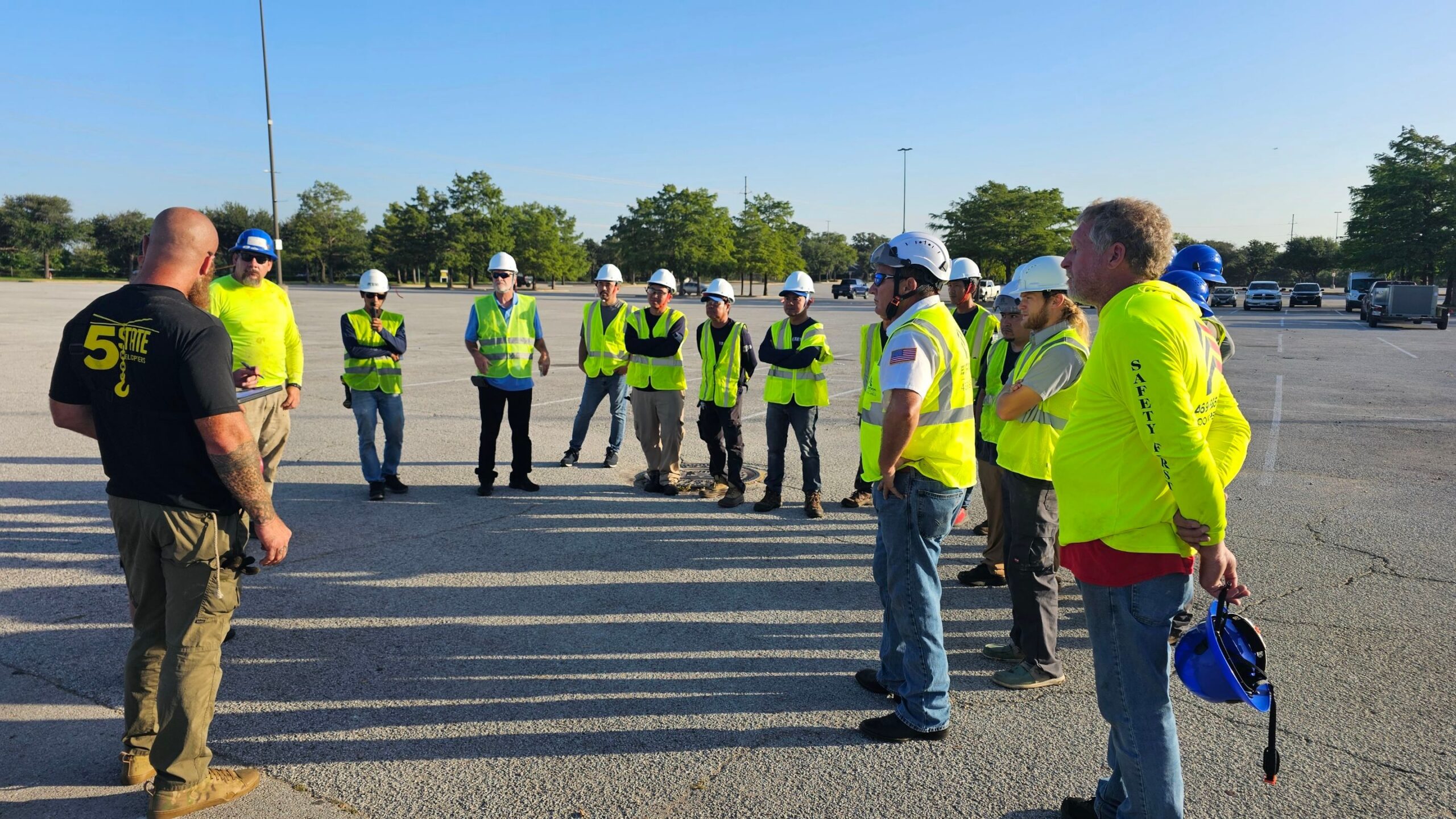Large Expedition HVAC crew briefing before major commercial rooftop HVAC installation project DFW