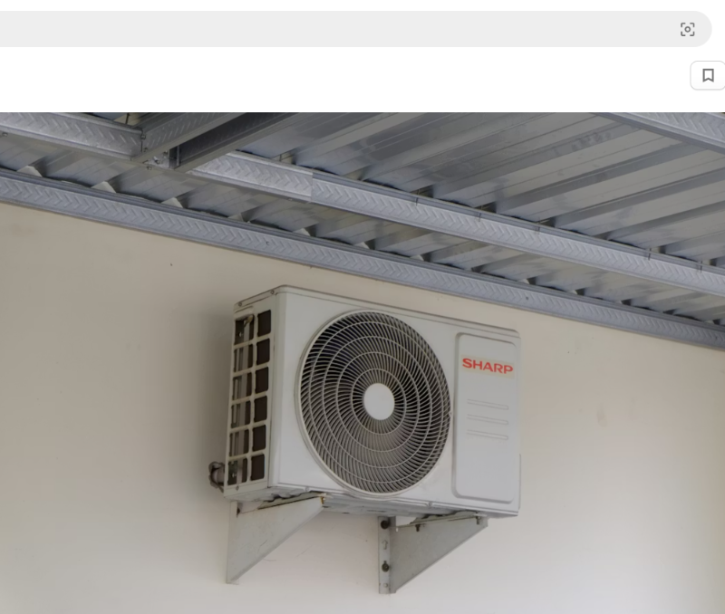 Outdoor AC unit mounted on wall - air conditioner freeze up repair